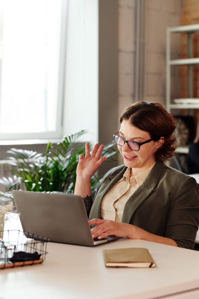 Woman Using MacBook to connect while housebound